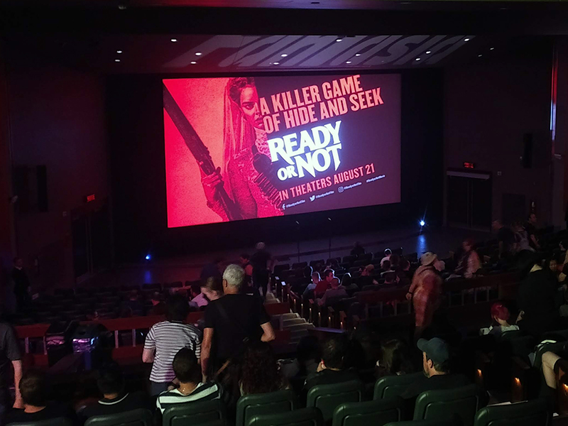 Attendees file in for a screening of Ready or Not (2019).